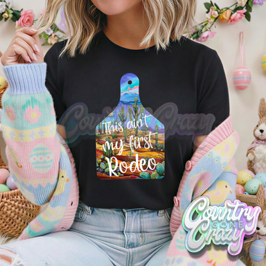 THIS AIN'T MY FIRST RODEO // BLACK T-SHIRT-Country Gone Crazy-Country Gone Crazy